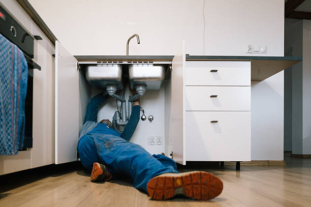 Professional Plumbing technician working in Breezy Point, NY